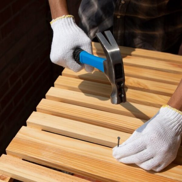 construction-worker-using-hammer-job-site_23-2150530710